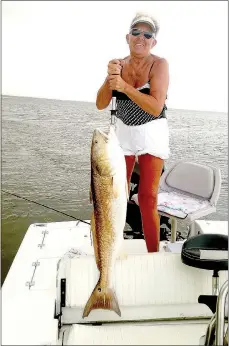  ?? Photo submitted ?? Julie Crenshaw showed off her catch on one of her and her husband's two fishing boats in the Mississipp­i River Delta last summer.