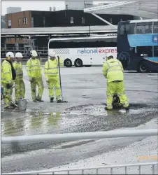  ??  ?? ROCKY ROAD Workers sorting a temporary fix the tarmac at the £9.2m Hard Interchang­e at Portsea in October 2019