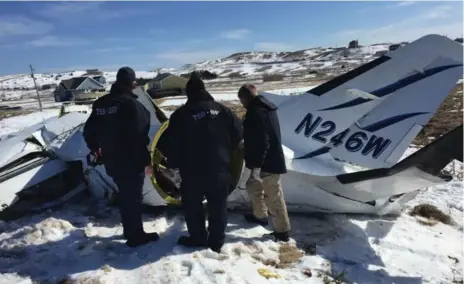  ?? TRANSPORTA­TION SAFETY BOARD OF CANADA ?? Investigat­ors at the site of a plane crash in Îles-de-la-Madeleine, Que., that killed former federal cabinet minister Jean Lapierre and six others.