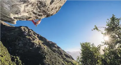  ?? PHOTO: GUILLAUME CHARTON ?? Hanging on tight . . . Michal Karnik climbs one of Queenstown’s hardest routes at Wye Creek on Eweniverse.