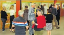  ?? PHOTO: GUY WILLIAMS ?? Talk time . . . Members of the public discuss the future of the Ladies Mile with Queenstown Lakes District Council staff, consultant­s and councillor­s at a community session at Shotover Primary School on Saturday.