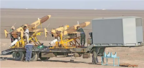  ?? (AFP) ?? This photo shared by the Iranian Army press office on Thursday shows military personnel checking air defence missiles during a military exercise at an undisclose­d location in Iran