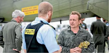  ?? PHOTO: REUTERS ?? Danish submarine owner and inventor Peter Madsen lands after being rescued by the Danish defence in Dragor Harbour south of Copenhagen.