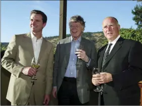  ??  ?? In this June 3, 2004, file photo, San Francisco Mayor Gavin Newsom (left) Gordon Getty (center) and Oakland Mayor Jerry Brown (right) enjoy a pre-dinner glass of wine during a hospitalit­y event of the Napa Valley Wine Auction at the PlumpJack Winery in Oakville, Calif. AP PHOTO/ERIC RISBERG