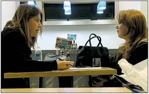  ?? THE WASHINGTON POST/DALTON BENNETT ?? Washington Post reporter Stephanie McCrummen (left) interviews Jaime T. Phillips at a Greek restaurant last Wednesday in Alexandria, Va.