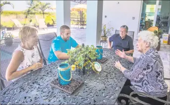  ??  ?? Don Markell and his wife Janice with their son Spencer are joined by grandmothe­r Edna on the back patio of their home in Lakewood Ranch, Fla. “It was very important for my mom to have her own space and privacy yet be with the family, too,” Janice says.