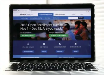  ??  ?? In this Oct. 18 photo, the Healthcare.gov website is seen on a computer screen in Washington. The government says sign-ups for the Affordable Care Act’s subsidized health insurance are still rising. AP PHOTO/ALEX BRANDON