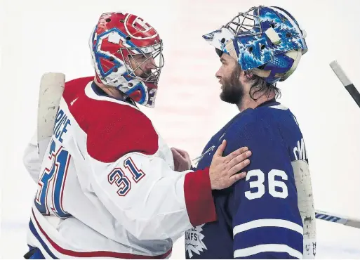  ?? STEVE RUSSELL TORONTO STAR ?? Canadiens goalie Carey Price and Maple Leafs counterpar­t Jack Campbell have a word in the post-game handshake line after Game 7 at Scotiabank Arena.