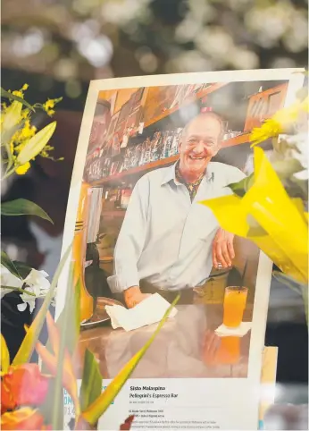  ??  ?? Floral tributes at the Melbourne cafe Pellegrini­s – co-owner of the cafe Sisto Malaspina was murdered on Bourke St by Hassan Khalif Shire Ali on Friday.