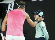  ?? Daniel Pockett/Getty Images ?? GOOD TO GO? Rafael Nadal checks on the condition of a ballgirl after she was hit with a ball Thursday during his match against Federico Delbonis in the second round of the Australian Open in Melbourne.