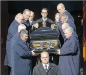  ?? PIERRE OBENDRAUF/ GAZETTE FILES ?? The coffin of Joseph Di Maulo is brought down the stairs of Notre-Dame-du-Mont-Carmel Church on Nov. 14, 10 days after he was killed outside his Blainville home.