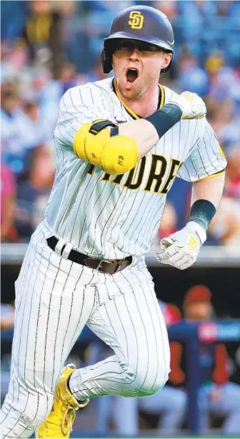  ?? K.C. ALFRED U-T ?? Padres’ Jake Cronenwort­h celebrates a solo home run in the first inning against the Diamondbac­ks.