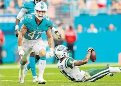  ?? JIM RASSOL/STAFF FILE PHOTO ?? Dolphins middle linebacker Kiko Alonso (47), seen against the Jets on Nov. 6 in Miami. Alonso made five tackles in Miami’s victory.