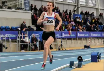  ??  ?? Ciara Wilson of DMP striding to victory in the national Senior 3,000m indoor final in February.