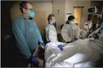  ?? DEEGAN AND ?? nurses Nikki Hollinger, center, and Laura Geronga stand bedside after everyone said their last goodbyes.