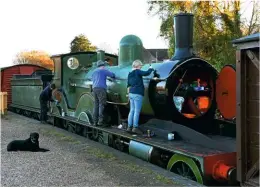  ?? PETER ZABEK ?? Team effort: On November 5, volunteers give No. 563 one final spruce-up in the former goods yard at Corfe Castle before the ‘T3’s’ farewell photo charter the following week.