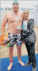  ?? Picture: Supplied ?? Swimming Coach Francois Theron is seen with regional manager for CHOC KZN, Agie Govender after he completed the event.