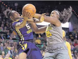  ?? JERRY LARSON/ASSOCIATED PRESS ?? West Virginia’s Tynice Martin (5) tries to shoot while being defended by Baylor’s Kalani Brown during Saturday’s game.