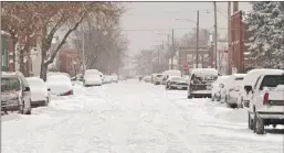  ?? | POST-TRIBUNE FILE PHOTO ?? The heavy lake-effect snow that blanketed East Chicago on Jan. 21 helped add to a potentiall­y record-setting winter, but predicted snowfall totals for this weekend in Northwest Indiana vary widely.