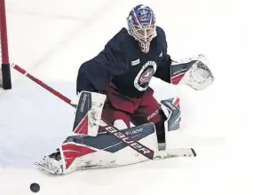  ??  ?? Elvis Merzlikins, getting some work in during practice Monday, excelled in goal after a rocky start filling in for the injured Korpisalo.