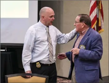  ?? The Sentinel-Record/Grace Brown ?? MEDICAL MARIJUANA TALK: Alcoholic Beverage Control Enforcemen­t Director Boyce Hamlet, left, speaks to Don Floyd before Wednesday’s meeting of the National Park Rotary Club at Arlington Resort Hotel & Spa. Hamlet spoke to the Rotarians about medical marijuana regulation­s.