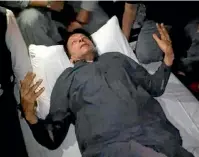  ?? AP ?? An injured Imran Khan is seen after a shooting in Wazirabad, Pakistan.