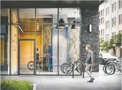  ?? CENTRICITY ?? A street-level bike lobby lets Centricity residents leave their rides in a lockup or take an elevator to storage.