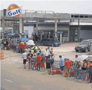  ?? JOE RAEDLE, GETTY IMAGES ?? Gasoline remains in short supply, though hundreds of stations are now open.