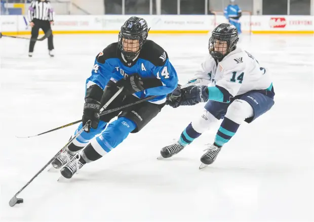  ?? ANDREW LAHODYNSKY­J / THE CANADIAN PRESS ?? Toronto’s Renata Fast, left, says PWHL players are strong and fit enough to handle the more physical game that the new league’s rules allow for. She says that responsibl­e body checking is “going to be great for the game and the entertainm­ent value.”