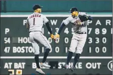  ?? AP/WINSLOW TOWNSON ?? Houston Astros’ Carlos Correa (1) and George Springer celebrate Friday after their win over the Boston Red Sox in Boston.