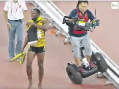  ??  ?? And it was all going so well – world champion Usain Bolt takes the applause of the Beijing crowd but is blissfully unaware of the Chinese cameraman behind him who has lost control of his Segway. The pair tumbled to the ground but the track star emerged unscathed