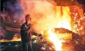  ?? SI WEI / FOR CHINA DAILY ?? A worker at the production line of a State-owned steel plant in Lianyungan­g, Jiangsu province.