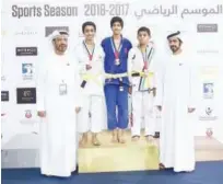  ??  ?? Winners of the Al Shaheed Jiu-jitsu Championsh­ip pose with the officials.