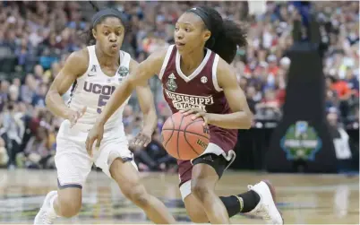  ?? (Photo by LM Otero, AP) ?? Mississipp­i State guard Morgan William, right, drives around Connecticu­t guard Crystal Dangerfiel­d during the NCAA Women’s Final Four in March. The 66-64 victory by MSU over No. 1 UConn earned the Bulldogs an ESPY award for Best Upset on Wednesday.