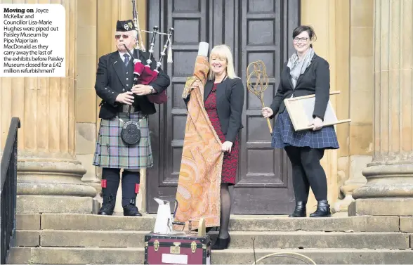  ??  ?? Moving on Joyce McKellar and Councillor Lisa-Marie Hughes were piped out Paisley Museum by Pipe Major Iain MacDonald as they carry away the last of the exhibits before Paisley Museum closed for a £42 million refurbishm­enT