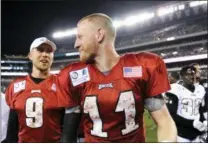  ?? MICHAEL PEREZ — THE ASSOCIATED PRESS ?? In this Aug. 5, 2018, file photo, Philadelph­ia Eagles’ Carson Wentz, right, talks to Nick Foles at the end of practice at NFL football training camp, in Philadelph­ia. Carson Wentz has been cleared to return and is slated to start for the Eagles against Indianapol­is in Week 3.