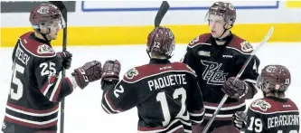  ?? CLIFFORD SKARSTEDT/EXAMINER ?? Peterborou­gh Petes' Nikita Korostelev (25) celebrates his goal with teammates Chris Paquette, Matt Timms and Semyon Der-Arguchints­ev scored on a power play against Ottawa 67s goalie Olivier Tremblay during first period OHL action on Saturday night at...