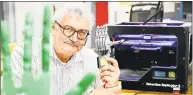  ?? Peter Hvizdak / Hearst Connecticu­t Media file photo ?? Bruce O’Donnell, 66, uses a 3- D printer as he works on a mechanical prosthesis in New Haven.