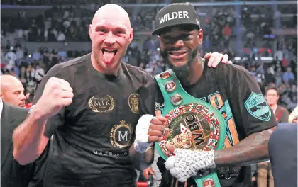  ?? Picture: Reuters ?? BIG MATES. Deontay Wilder (right) and Tyson Fury show each other some love after their WBC world heavyweigh­t title fight ended in a draw at the Staples Centre on Saturday night.