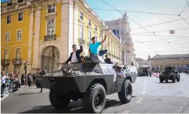  ?? Photograph: Antonio Pedro Santos/EPA ?? Old military vehicles arrive for a ceremony marking the 50th anniversar­y of the Carnation Revolution in Lisbon, Portugal, 25 April 2024.