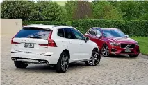  ??  ?? Twin-engine T8 in white and D5 turbo-diesel in new Fusion Red colour. Both R-Design specificat­ion.