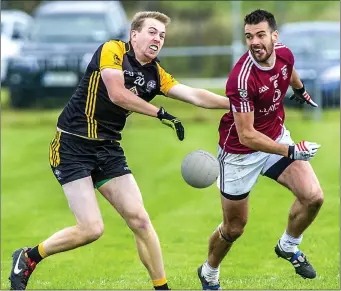  ?? Pic: Tom Callanan. ?? Robert Jacob of Enniscrone/Kilglass and Shamrock Gaels’s Paul Higgins in action at Bunninadde­n last Sunday in the Kennedys Intermedia­te Football Championsh­ip semi final.