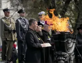  ?? CZAREK SOKOLOWSKI — THE ASSOCIATED PRESS ?? A rabbi prays at a Warsaw Ghetto Uprising commemorat­ion reception in Poland on Wednesday. Jews who took up arms against Nazi forces in 1943 were remembered.