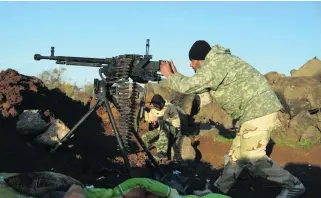  ?? Reuters ?? Free Syrian Army fighters take aim at the frontline in Deraa. A series of conflicts is under way in the south, involving Jabhat Al Nusra, the Jihad Army, the Brigades, the FSA and pro-government forces.