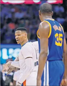  ?? [SUE OGROCKI/ASSOCIATED PRESS FILE PHOTO] ?? Oklahoma City Thunder guard Russell Westbrook, left, comments to Golden State Warriors forward Kevin Durant (35) as they walk offcourt for a timeout in the third quarter Feb. 11 in Oklahoma City.