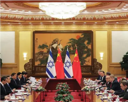  ?? (Lintao Zhang/Reuters) ?? London CHINESE AND ISRAELI officials meet at the Great Hall of the People on Monday in Beijing. Israeli businessme­n who accompanie­d the delegation reportedly signed deals worth some NIS 7.3b.