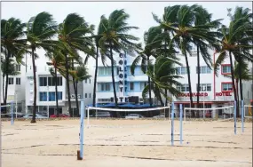  ?? PHOTO BY CARL JUSTE/MIAMI HERALD VIA AP ?? Volleyball courts on Lummus Park Beach, South Beach are empty as a tropical storm warning was issued for the Miami Beach, Fla., area on Monday, Sept. 3. Tropical Storm Gordon lashed South Florida with heavy rains and high winds on Monday, forcing holiday beachgoers to drier ground.