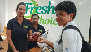  ?? Photo: Nicolette Chambers ?? Customer, Adi Litia Rareba served by Fresh Choice Supermarke­t cashier, Salma Bano and head cashier, Shabana Nisha on March 31, 2021.