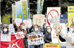  ?? —REUTERS ?? GRAVELY CONCERNED People rally in front of the Fukushima prefectura­l headquarte­rs on April 13 to protest against the Japanese government’s decision to discharge contaminat­ed radioactiv­e wastewater from the Fukushima Daiichi nuclear power plant into the sea.