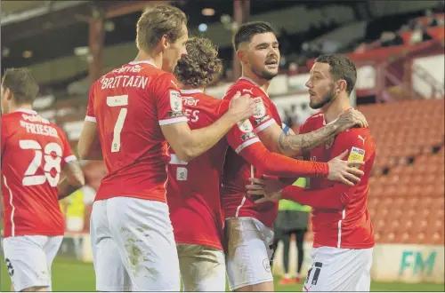  ?? PICTURE: BRUCE ROLLINSON. ?? OPENING NIGHT: Conor Chaplin, far right, celebrates scoring Barnsley’s second goal in their 3- 0 win over QPR at Oakwell in the Championsh­ip last night.